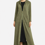 Woman wearing a long green hoodie with a white background