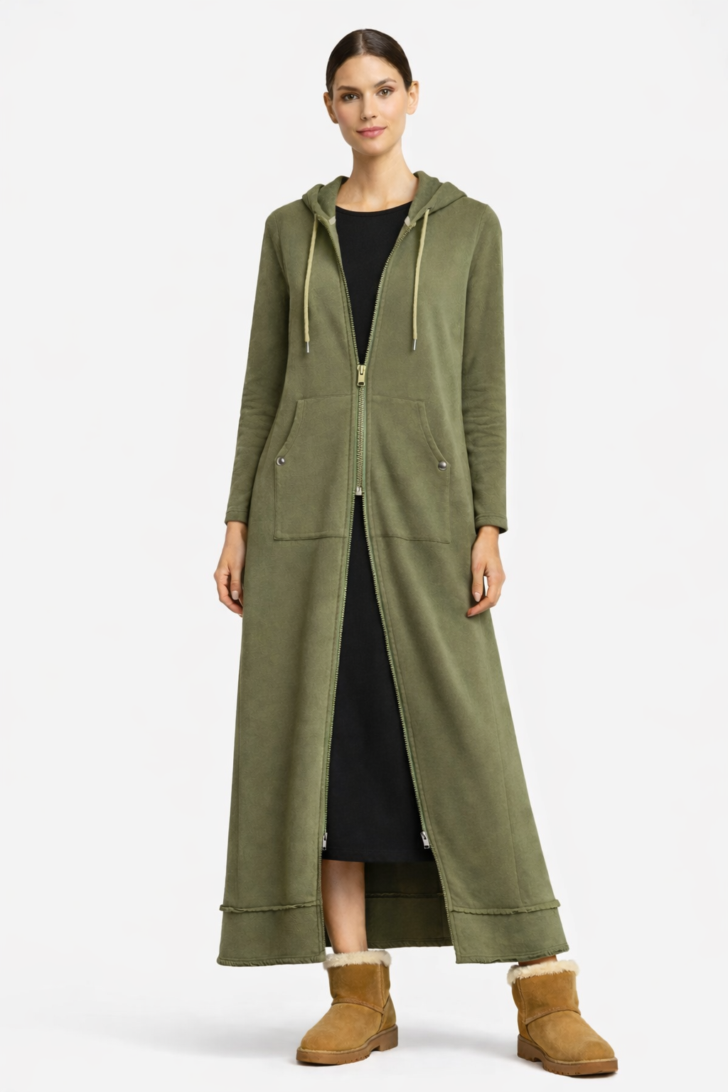 Woman wearing a long green hoodie with a white background