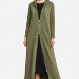 Woman wearing a long green hoodie with a white background